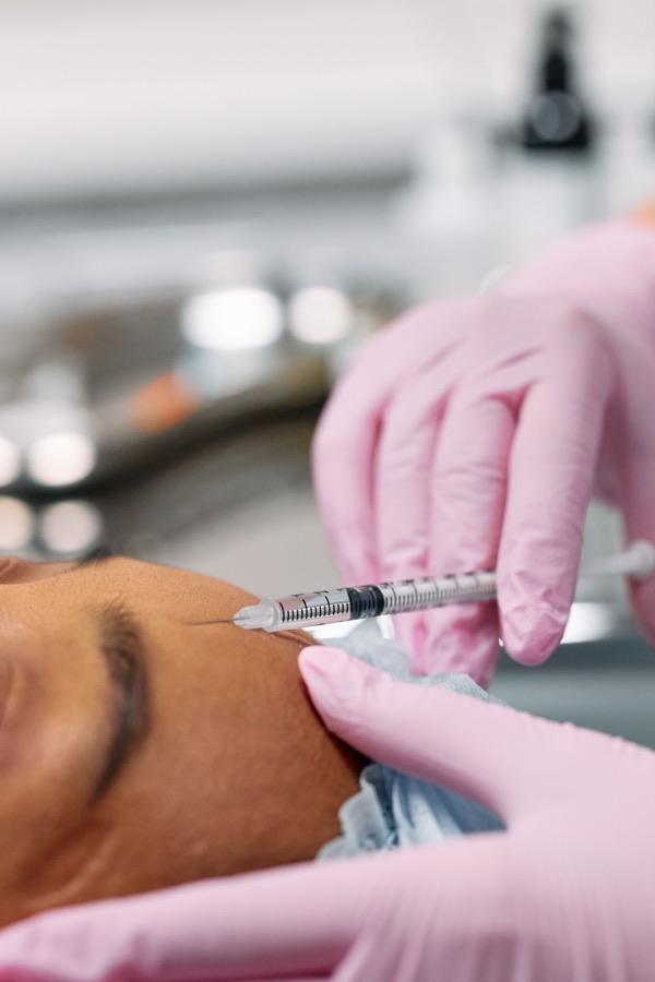 Close up of a precise Botox injection during treatment